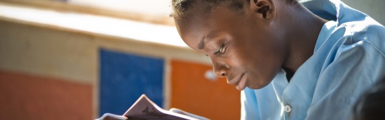A girl in Liberia reads a book