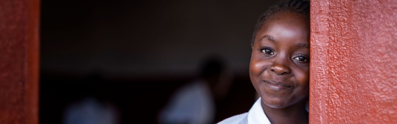 Child in Liberia at school waiting for Marys Meals