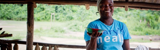 Volunteer cook in Liberia serving Marys Meals