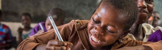 Child in Malawi learning in class