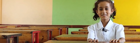 Child in Yemen in class waiting for Marys Meals