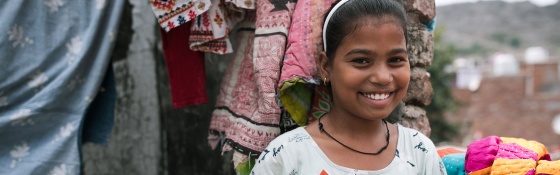 Child in India with their school book