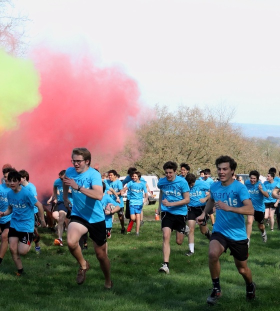 Fundraisers run among bright colours