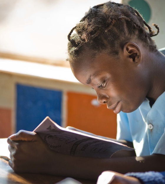 A girl in Liberia reads a book