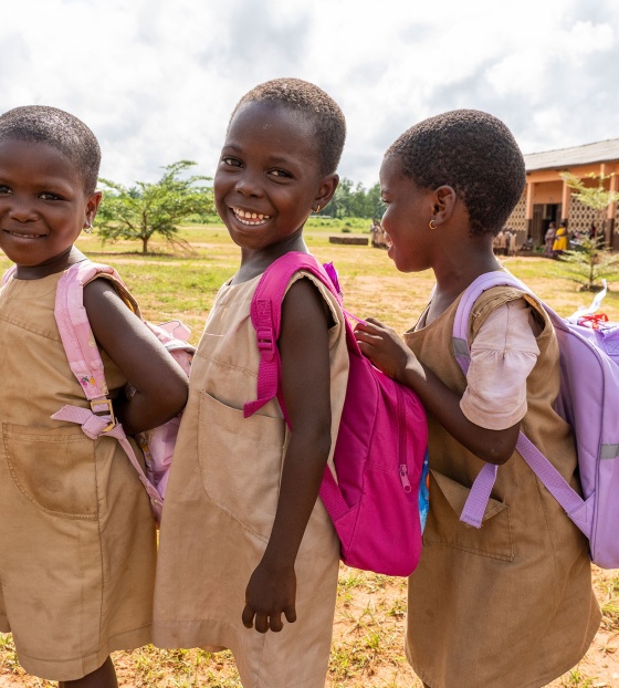 Children in Benin queuing for their school meal