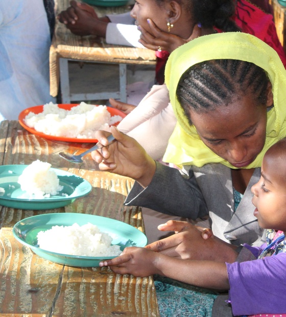 An Ethiopian mother feeds her child Marys Meals 