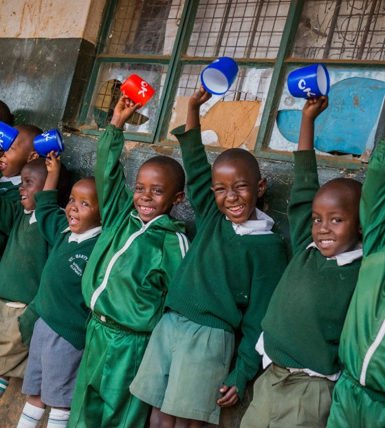 Children in Kenya waiting for their school meal