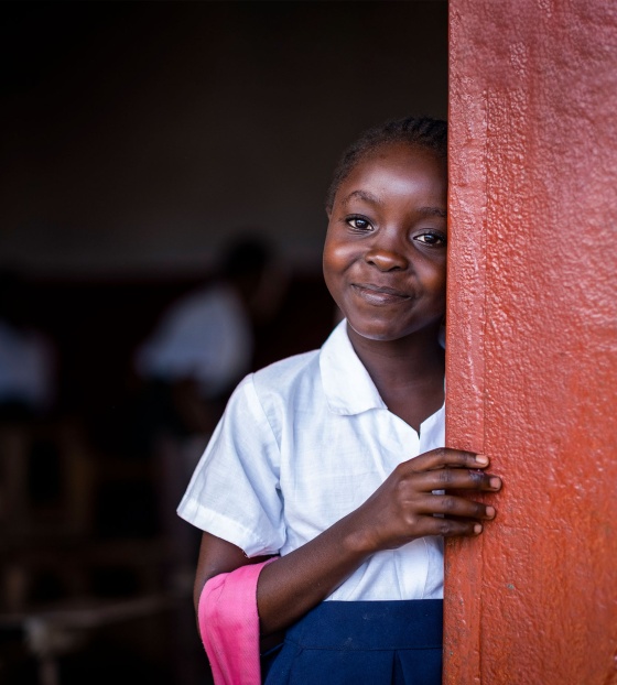 Child in Liberia at school waiting for Marys Meals