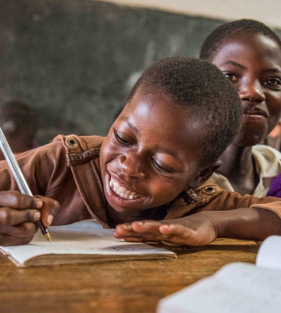 Child in Malawi learning in class