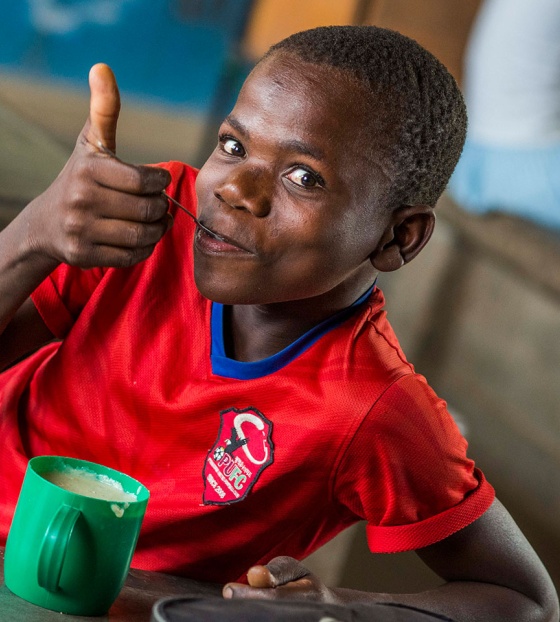 Child in Malawi enjoying Mary's Meals