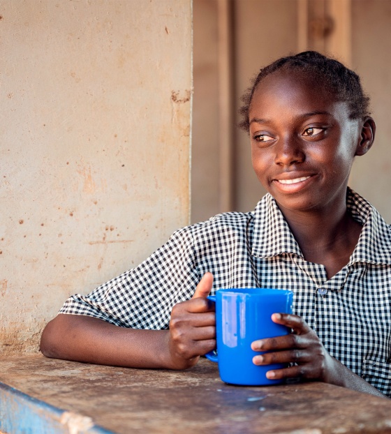 Child enjoying their nutritious mug of Marys Meals