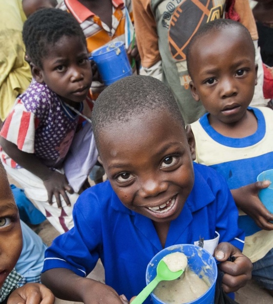 Children enjoying porridge in Malawi