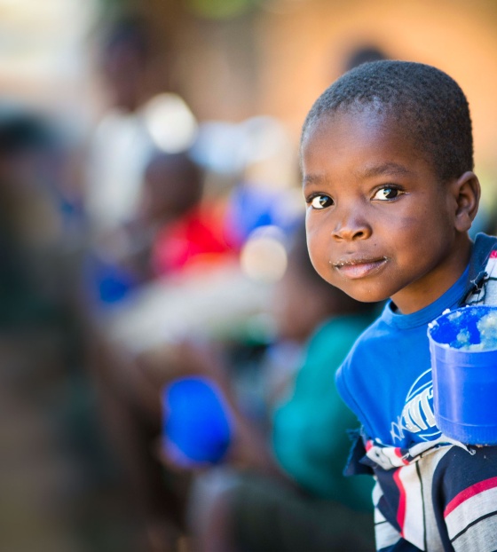 Child holding a mug