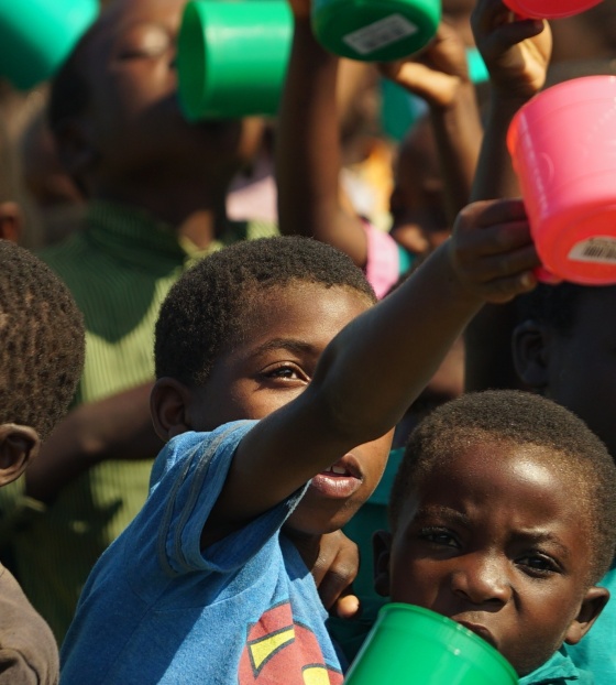 Children with their Mary's Meals mugs