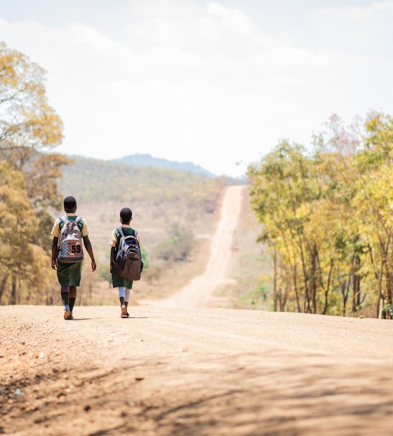 Girls walking to school to receive