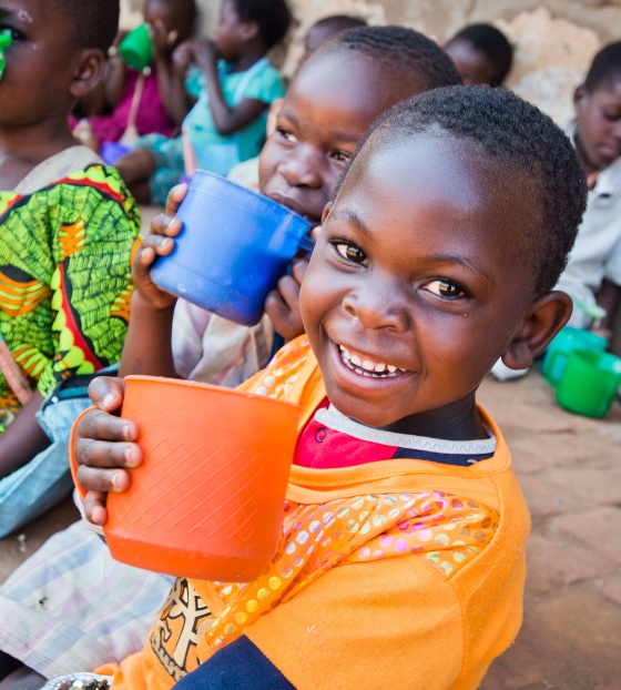 child holding mug