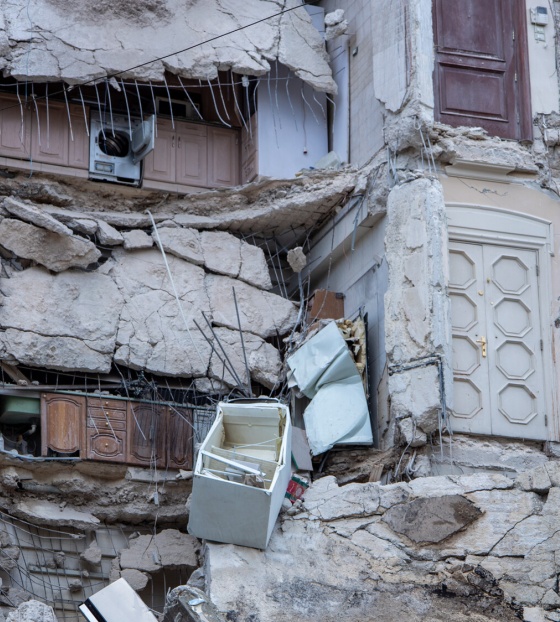 Kitchen cupboards visible within destroyed apartments from earthquake  in Syria