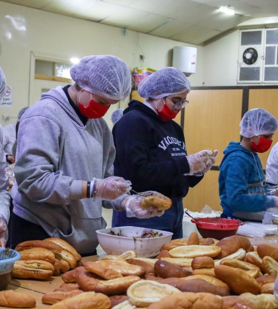 Volunteers for Dorcas preparing food 