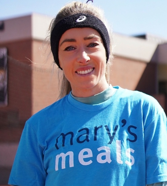 Eilish McColgan looks at camera while wearing Mary's Meals charity T-shirt