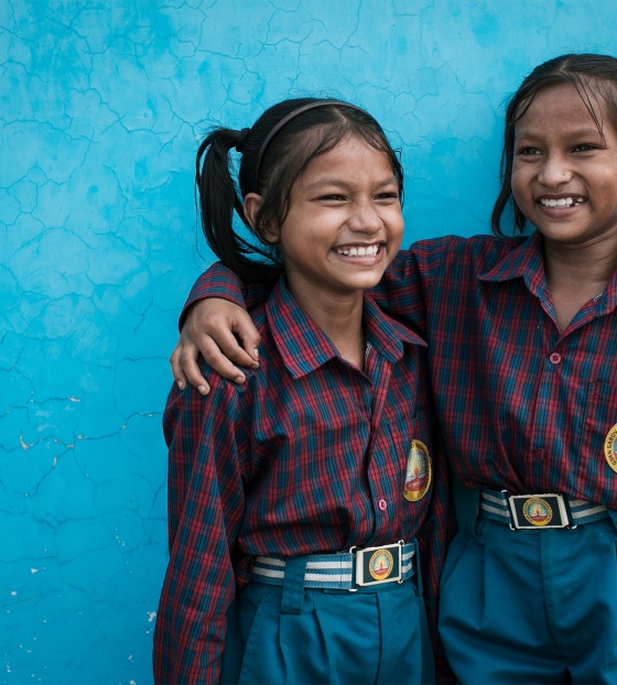 Twin sisters in India hugging