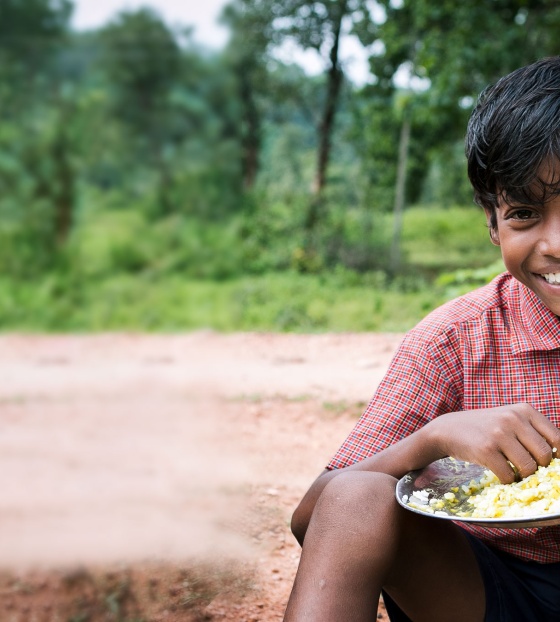 Child in India eating their school meal