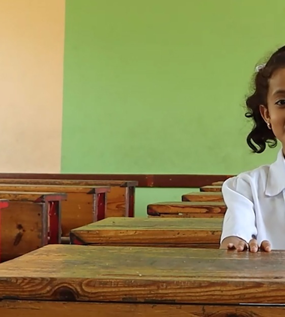 Child in Yemen in class waiting for Marys Meals