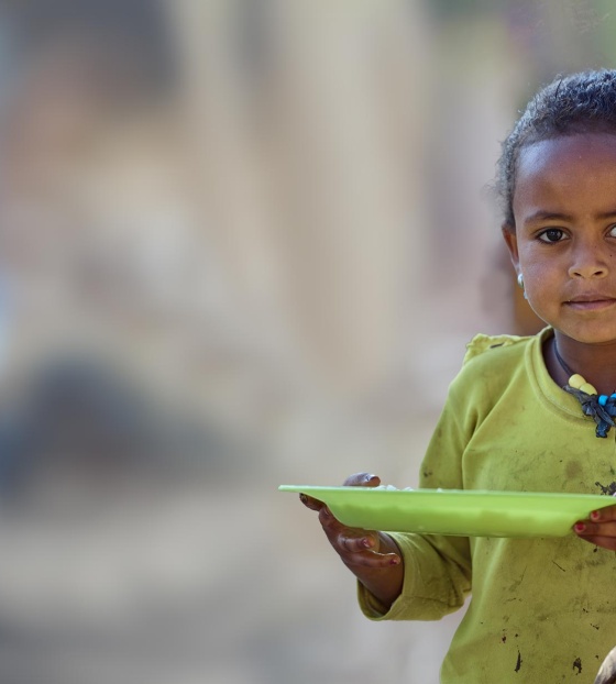 Child in Ethiopia with thier school meal