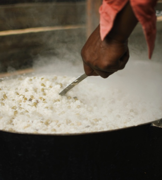 Image of pot of rice being stirred