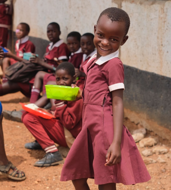 Image of a child in Zimbabwe holding their school meal