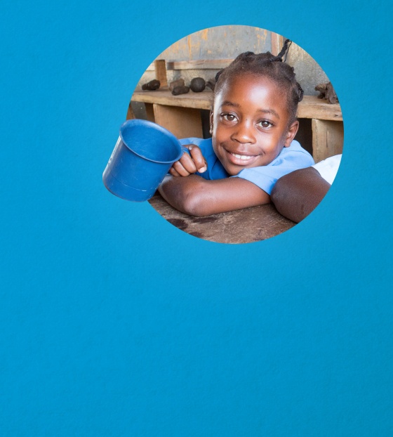 Image of child holding their school meal