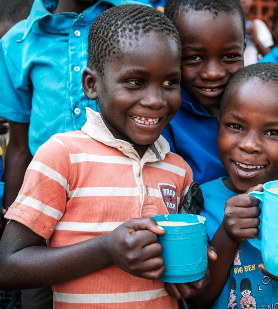 Children enjoying Mary's Meals at school in Malawi