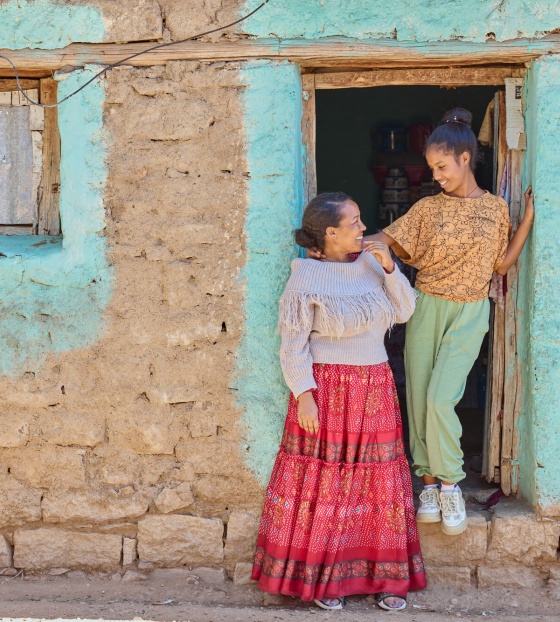 Lydia, right, and her mother, Shewit, left stand at an open doorway