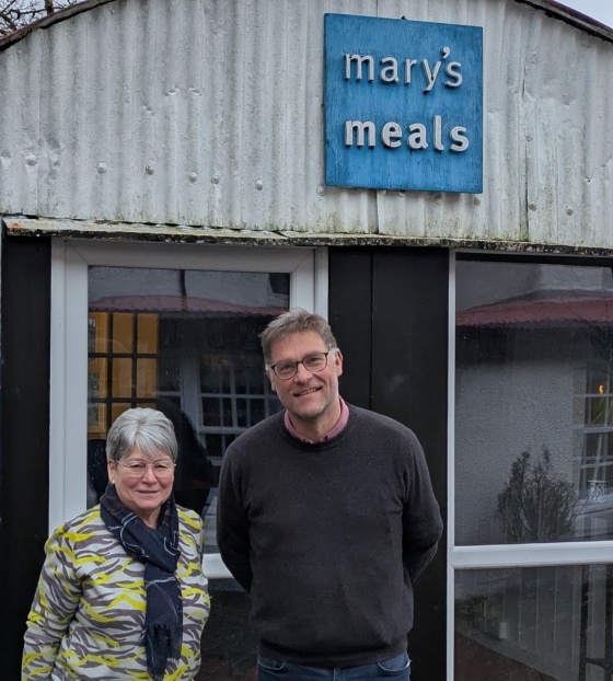 Julie Ramsay, Inner Wheel, with Mary's Meals Founder, Magnus MacFarlane-Barrow at the shed in Dalmally.