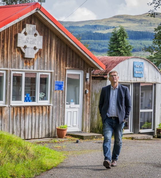 Magnus walking in front of the shed in Dalmally