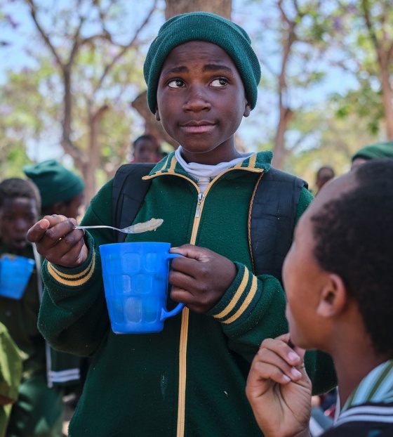 Image of a child with their school meal