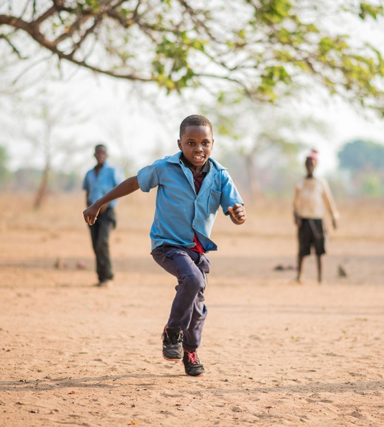 Falio in Zambia playing after his school meal