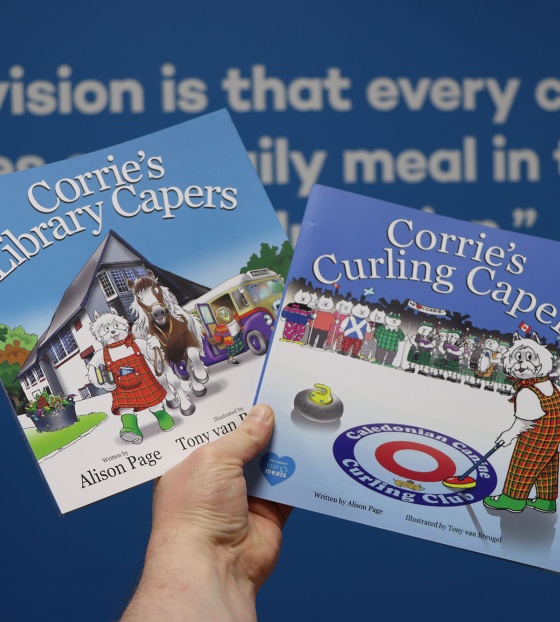 Image of hands holding books