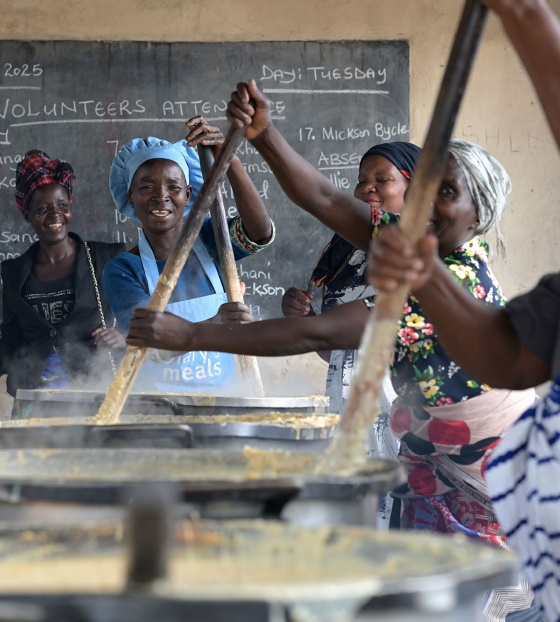 Imgae of volunteers cooking school meals