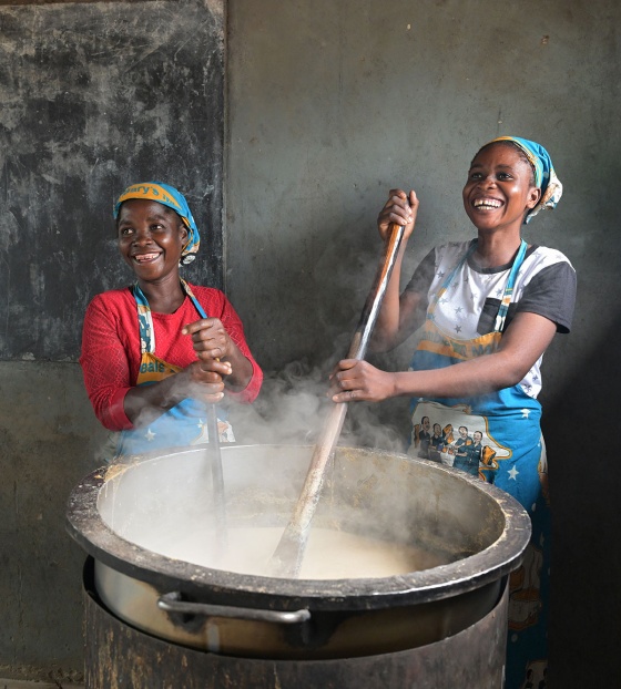 Volunteer cooks preparing school meals for the day