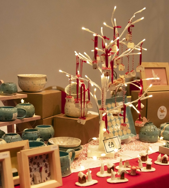 A display of homemade Christmas crafts on a table