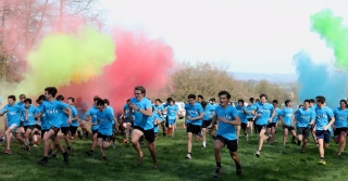 Fundraisers run among bright colours