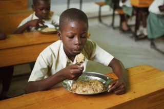 A child eats a meal in Haiti