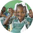 A child eats food in a classroom