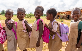 Children in Benin queuing for their school meal