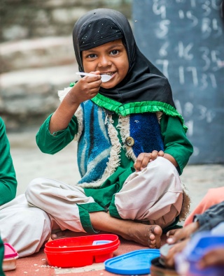 Child in India eating Marys Meals