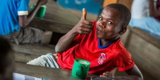 Child in Malawi enjoying Mary's Meals
