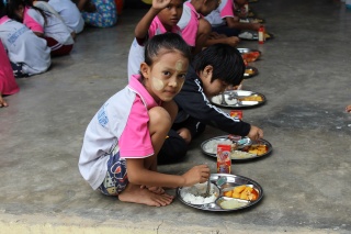 Child eating their school meal