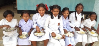 Girls in India eating Mary's Meals