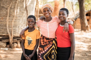 Sisters, Siblongile and Sarah, with their mother