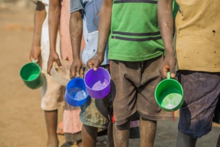 Malawi image of children with coloured mugs